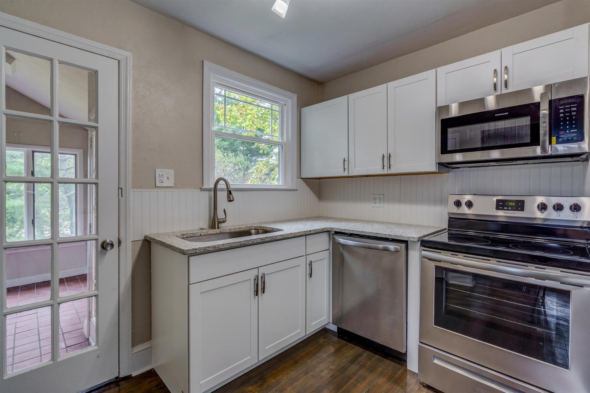1963 Kiska Road Salem, VA 24153 - Photo 11 of 29 a kitchen with stainless steel appliances granite countertop a sink stove and microwave