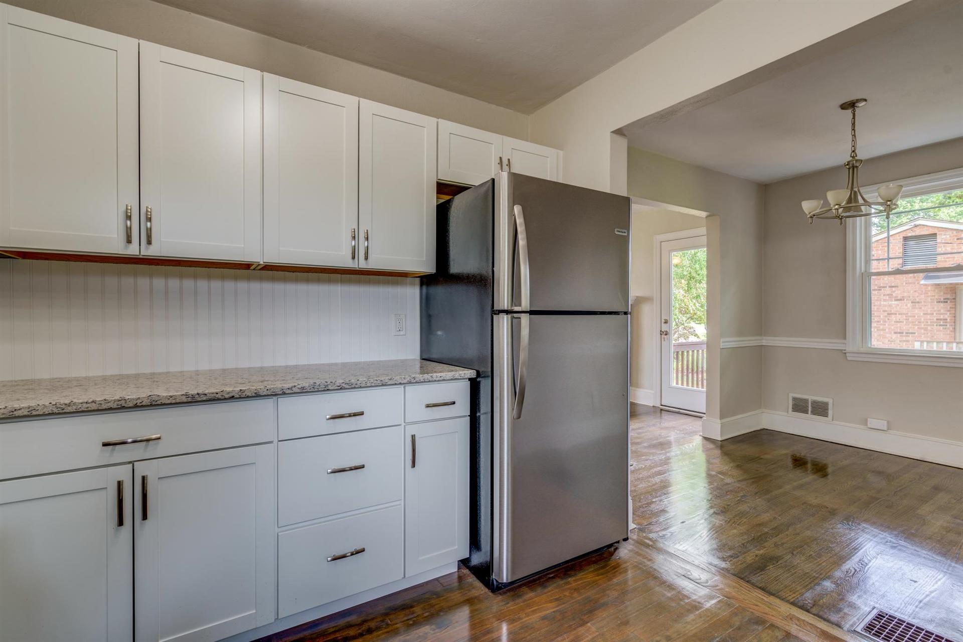 1963 Kiska Road Salem, VA 24153 - Photo 12 of 29 a kitchen with cabinets and a refrigerator