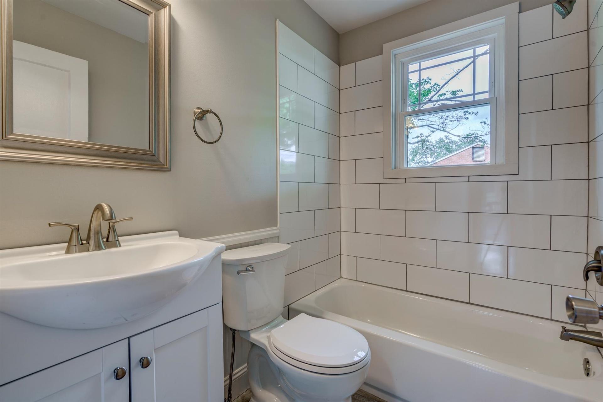 1963 Kiska Road Salem, VA 24153 - Photo 16 of 29 a bathroom with a sink mirror bathtub and toilet