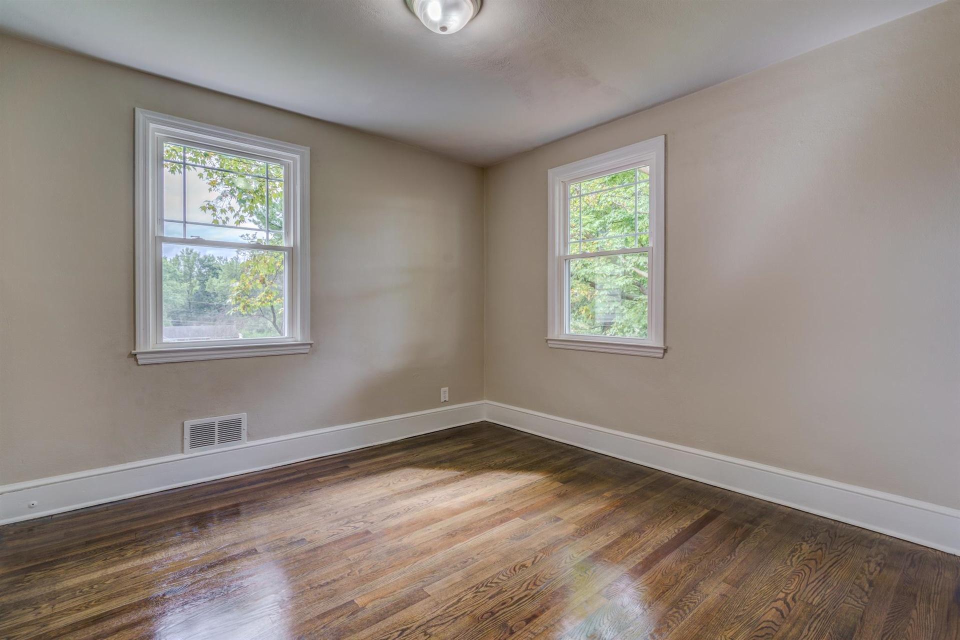 1963 Kiska Road Salem, VA 24153 - Photo 18 of 29 a view of an empty room with wooden floor and a window