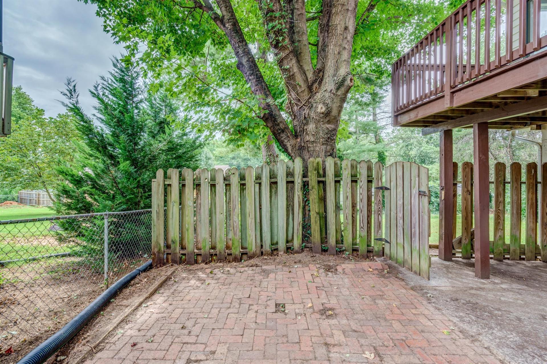 1963 Kiska Road Salem, VA 24153 - Photo 27 of 29 a view of a backyard with plants and wooden fence