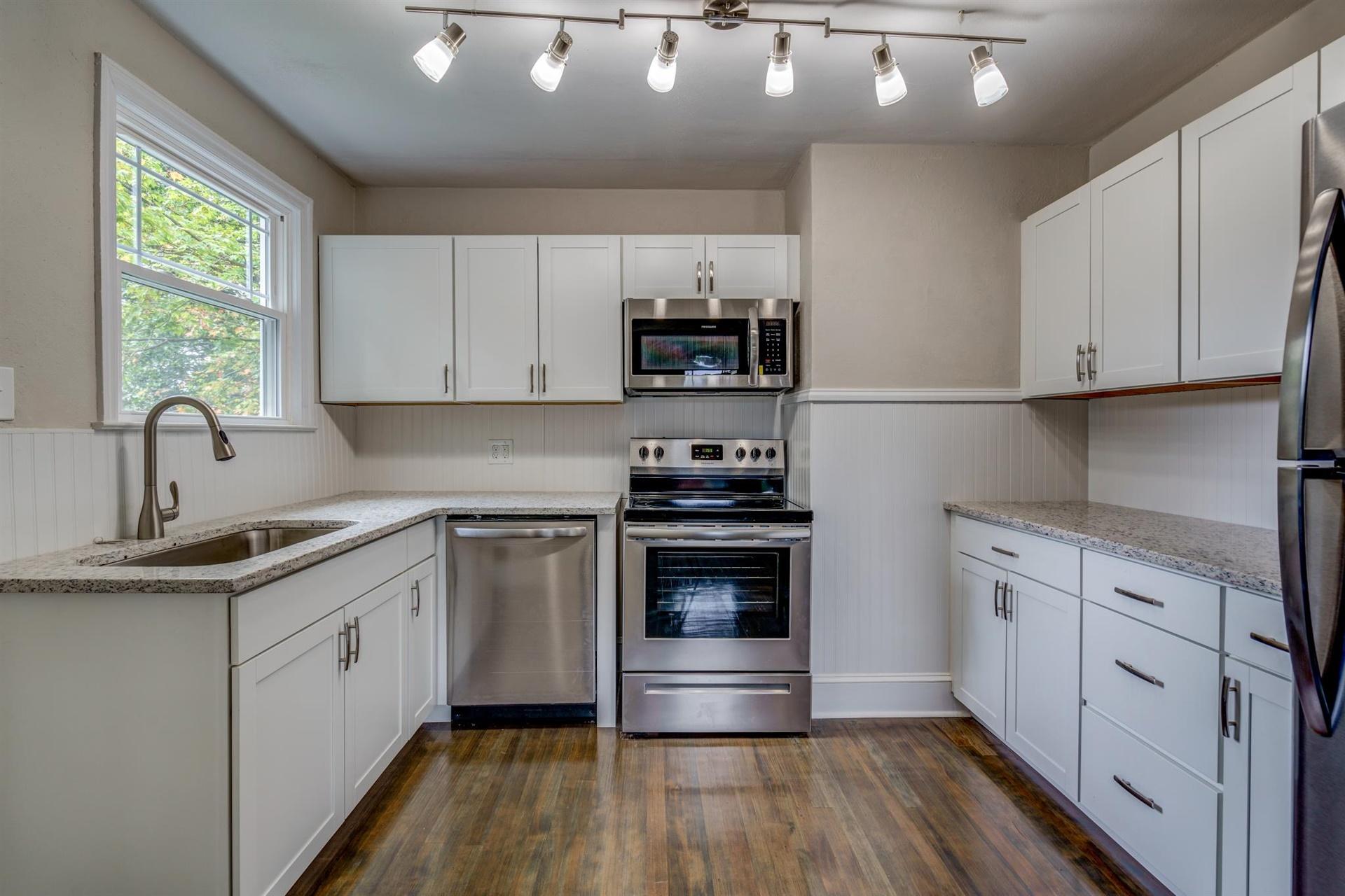 1963 Kiska Road Salem, VA 24153 - Photo 10 of 29 a kitchen with stainless steel appliances granite countertop a stove a sink and a refrigerator