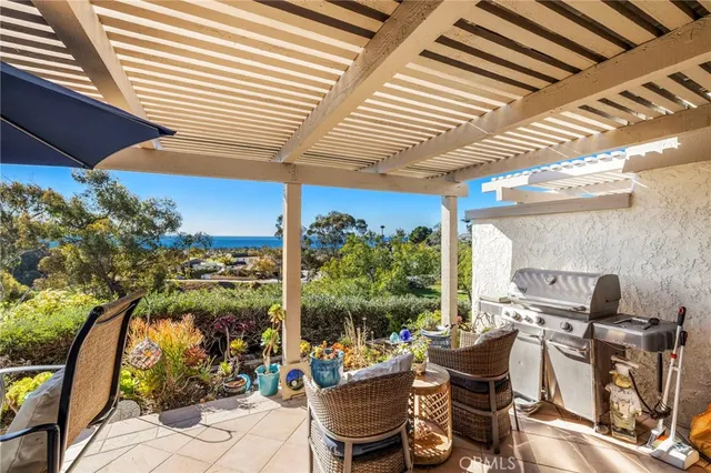 a view of a balcony with wooden fence and floor