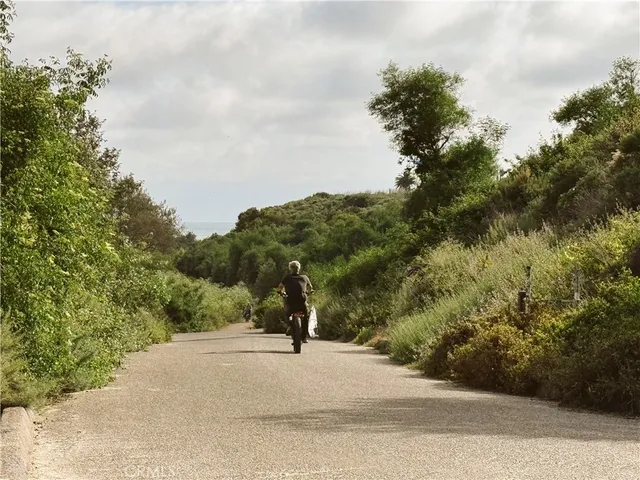 a view of a road with a yard