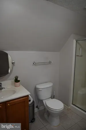 a bathroom with a sink toilet and vanity