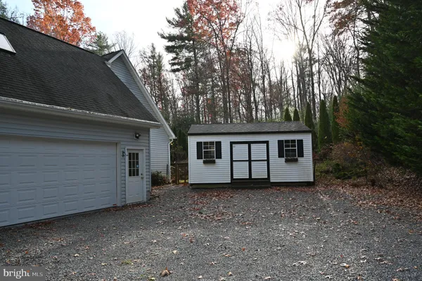 a house that has a tree in front of it