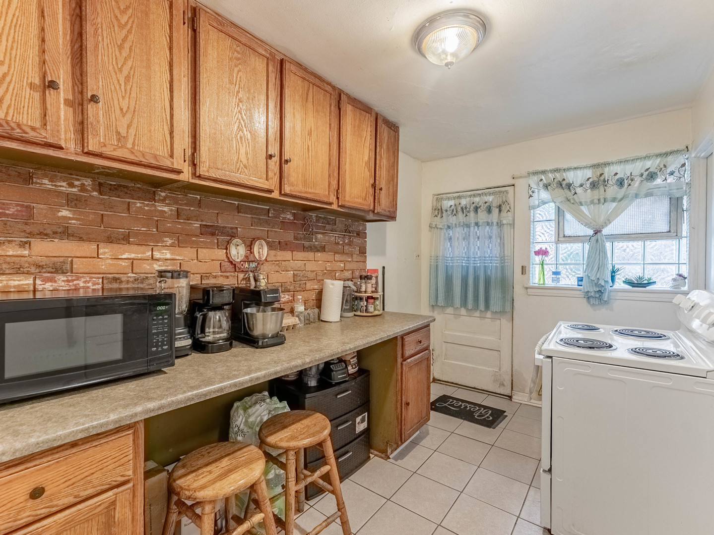 3847 Euclid Avenue Berwyn, IL 60402 - Photo 12 of 32 a kitchen with granite countertop a sink stove and cabinets