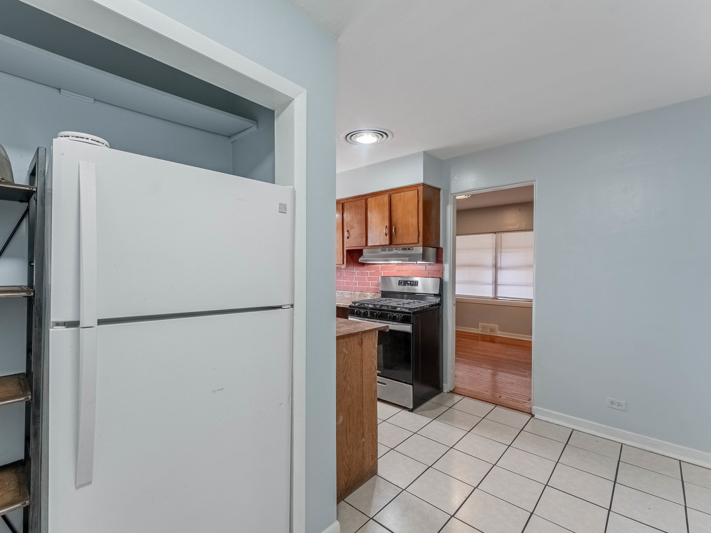 3847 Euclid Avenue Berwyn, IL 60402 - Photo 19 of 32 a white refrigerator freezer and a stove sitting inside of a kitchen