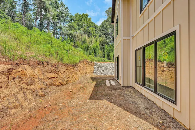 a view of a backyard of the house