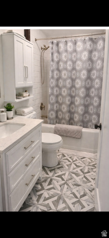287 100 North Orem, UT 84057 - Photo 13 of 18 Full bathroom featuring shower / bath combination with curtain and vanity