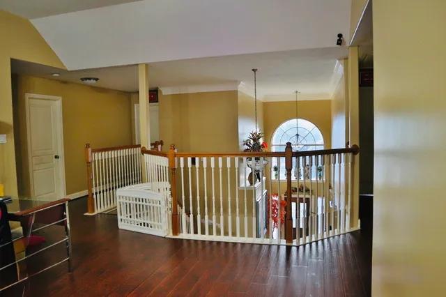 a view of a hardwood & staircase
