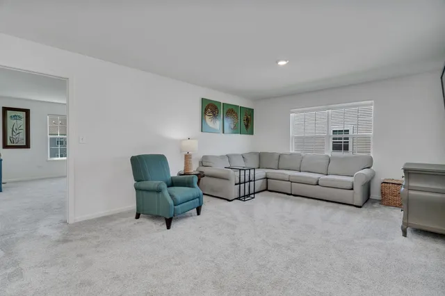 a living room with furniture and a couch