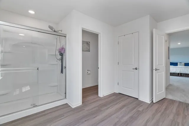 a view of entryway and wooden floor