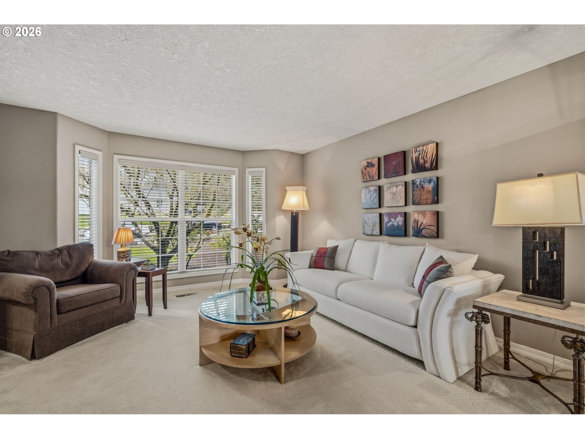 6108 Southwest Kruse Ridge Drive Portland, OR 97219 - Photo 3 of 42 a living room with furniture and a large window