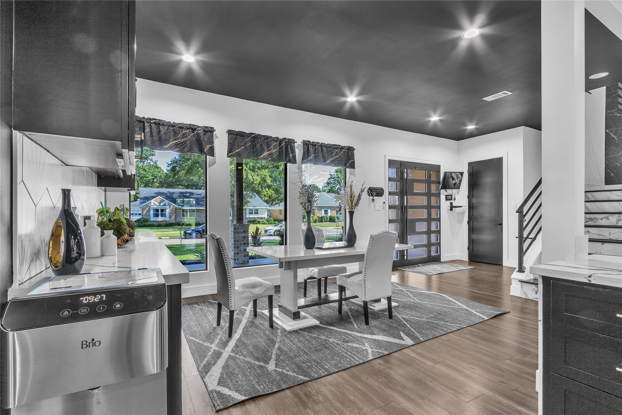 15406 Torry Pines Road Houston, TX 77062 - Photo 15 of 50 a dining room with stainless steel appliances granite countertop furniture wooden floor and a large window