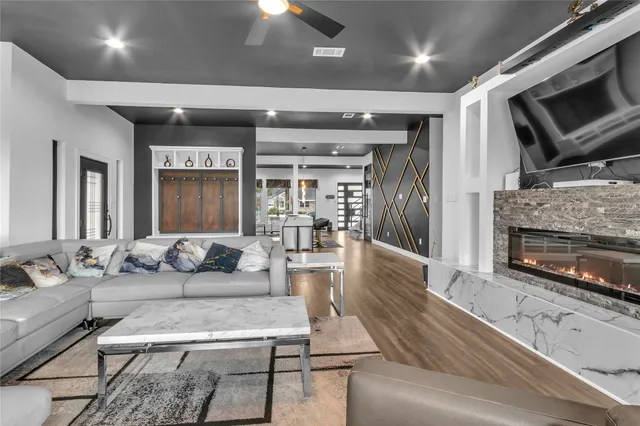 a bathroom with a sink and a mirror with bathtub