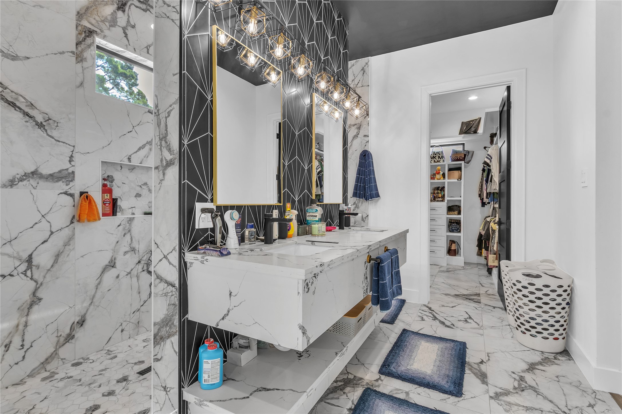 15406 Torry Pines Road Houston, TX 77062 - Photo 24 of 50 a bathroom with a sink a mirror and shower