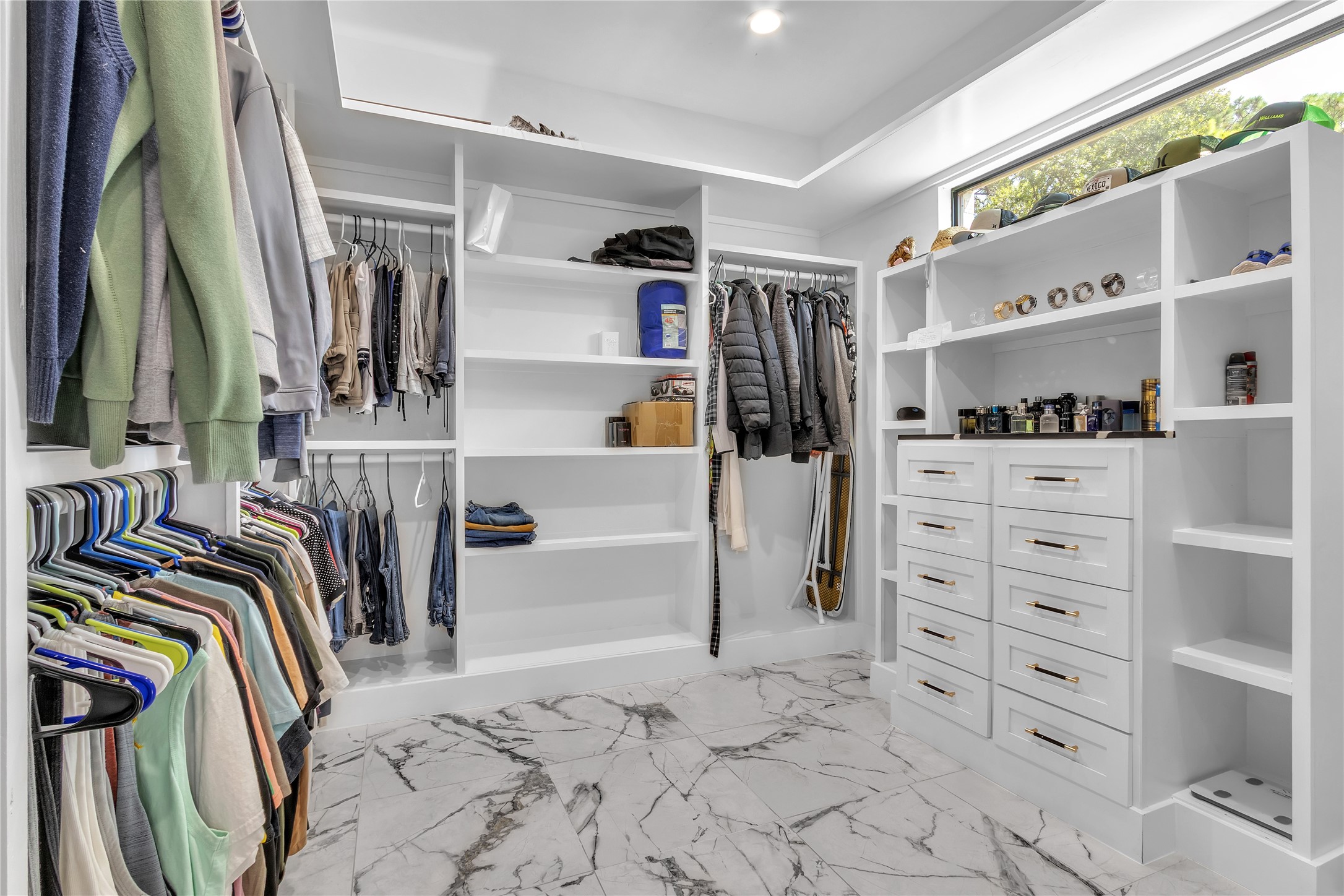 15406 Torry Pines Road Houston, TX 77062 - Photo 26 of 50 a view of walk in closet with clothes and shoes