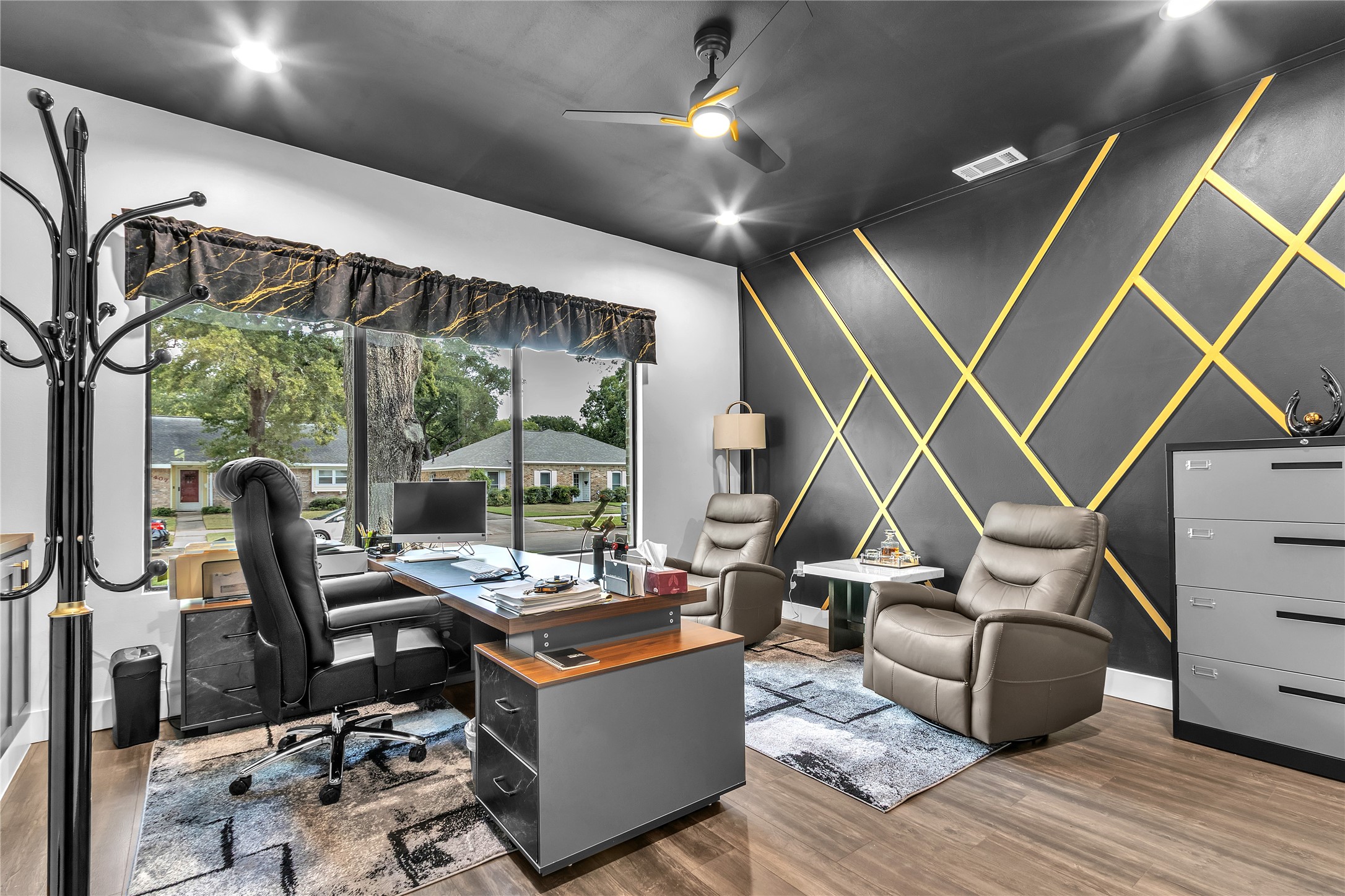 15406 Torry Pines Road Houston, TX 77062 - Photo 29 of 50 a work room with wooden floor furniture and a floor to ceiling window