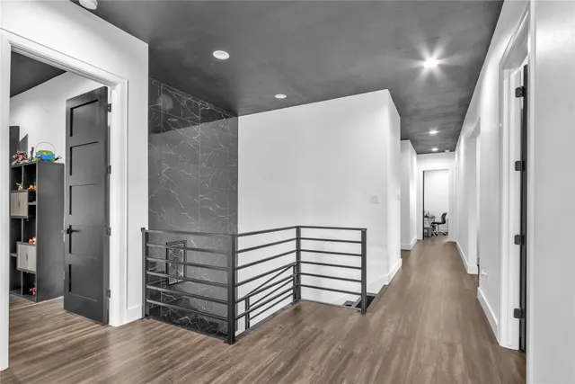 a bathroom with a shower curtain and a toilet