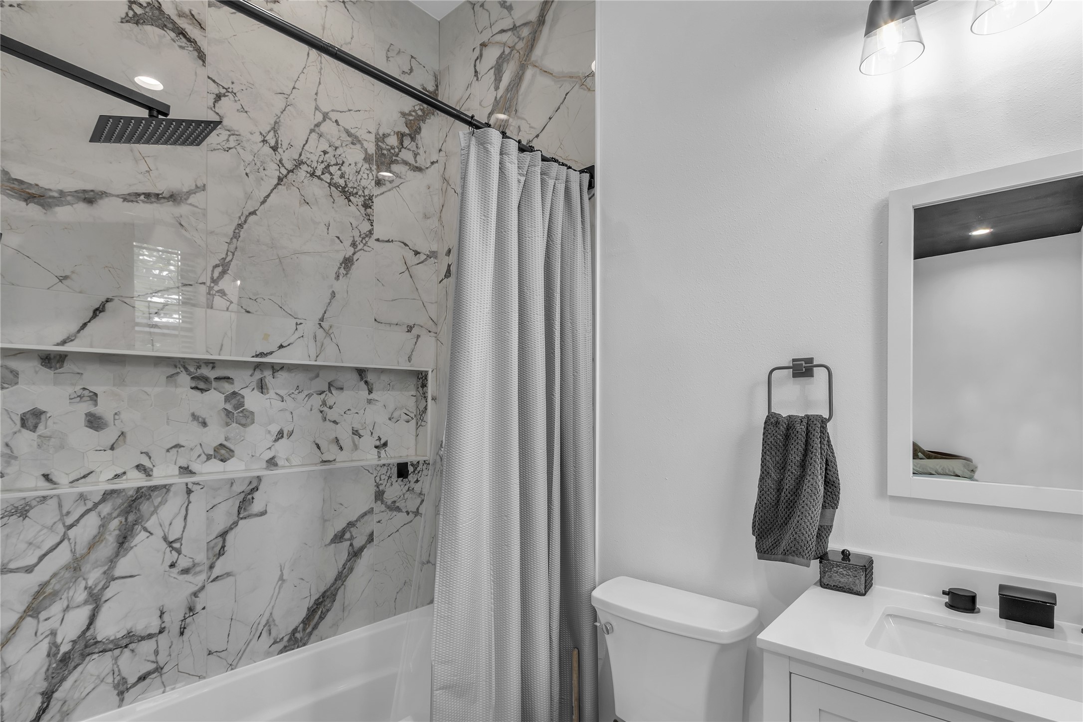 15406 Torry Pines Road Houston, TX 77062 - Photo 33 of 50 a bathroom with a shower curtain and a toilet