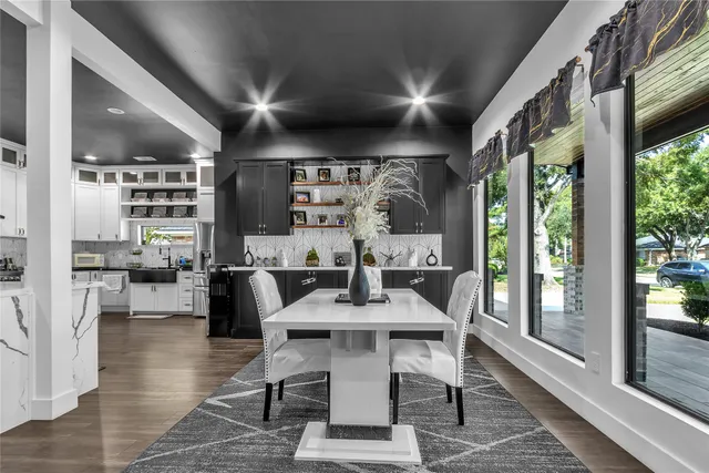 a dining room with furniture and wooden floor