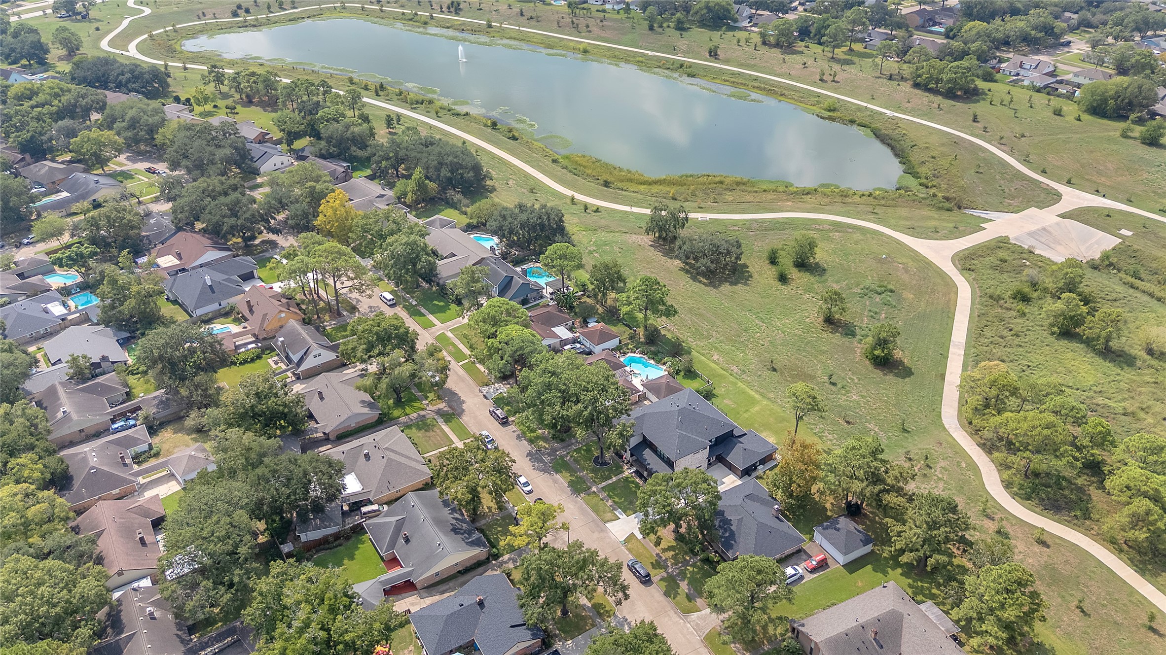 15406 Torry Pines Road Houston, TX 77062 - Photo 47 of 50 a view of a swimming pool with a yard