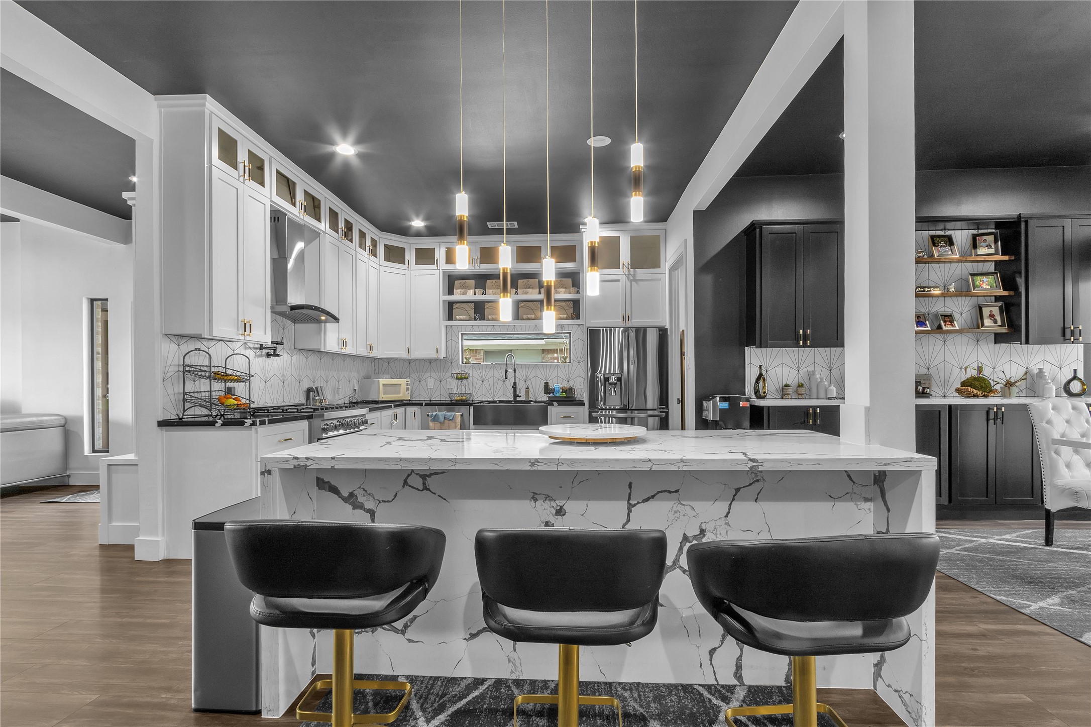 15406 Torry Pines Road Houston, TX 77062 - Photo 10 of 50 a kitchen with stainless steel appliances a dining table chairs sink and cabinets