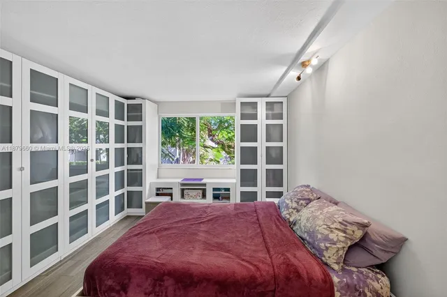 a bathroom with a sink toilet a mirror and shower