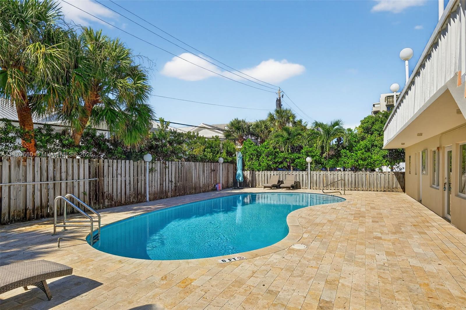 240 Galen Drive, Unit 207 Key Biscayne, FL 33149 - Photo 18 of 21 a view of a backyard with swimming pool