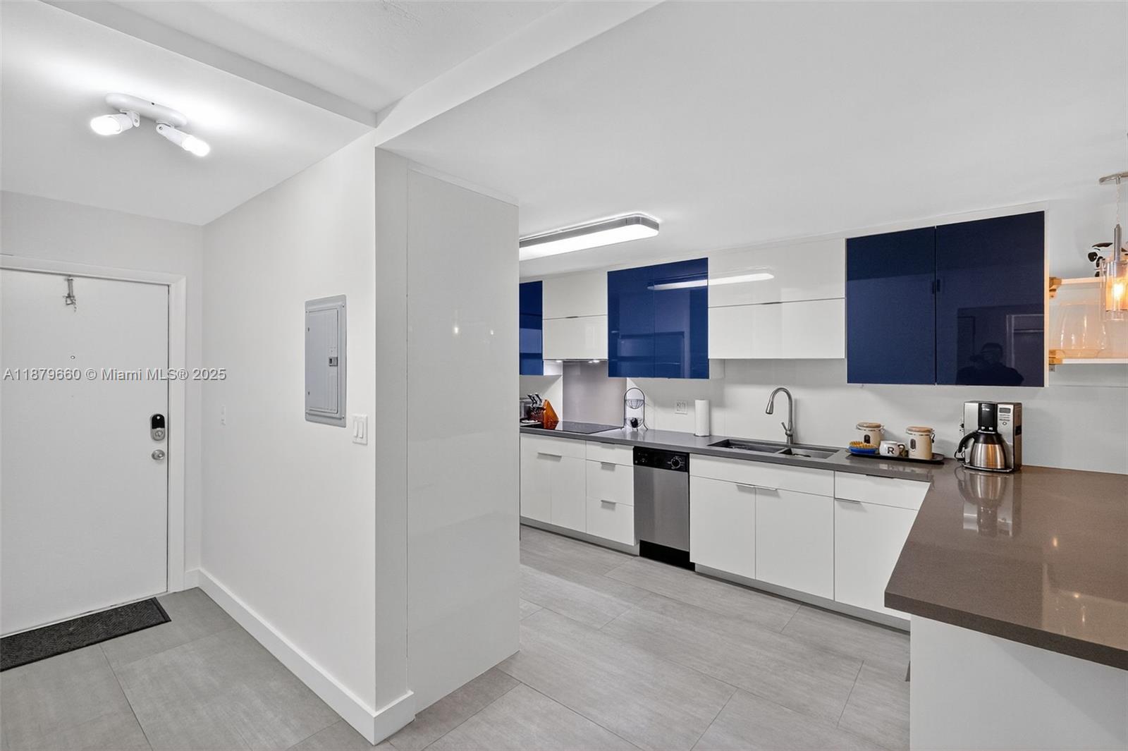 240 Galen Drive, Unit 207 Key Biscayne, FL 33149 - Photo 3 of 21 a kitchen with stainless steel appliances granite countertop a sink stove and refrigerator
