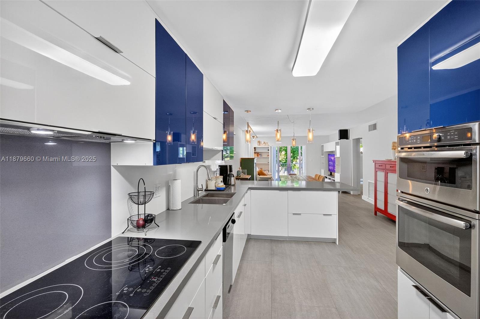 240 Galen Drive, Unit 207 Key Biscayne, FL 33149 - Photo 5 of 21 a kitchen with a sink appliances and cabinets