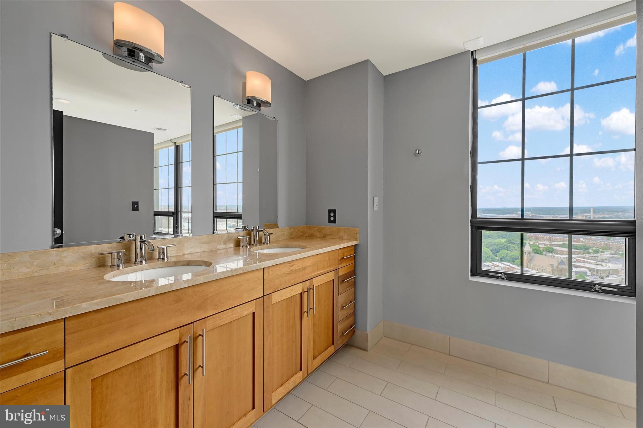 1200 Steuart Street, Unit 1913 Baltimore, MD 21230 - Photo 49 of 94 Owner's bathroom with modern dual vanities.