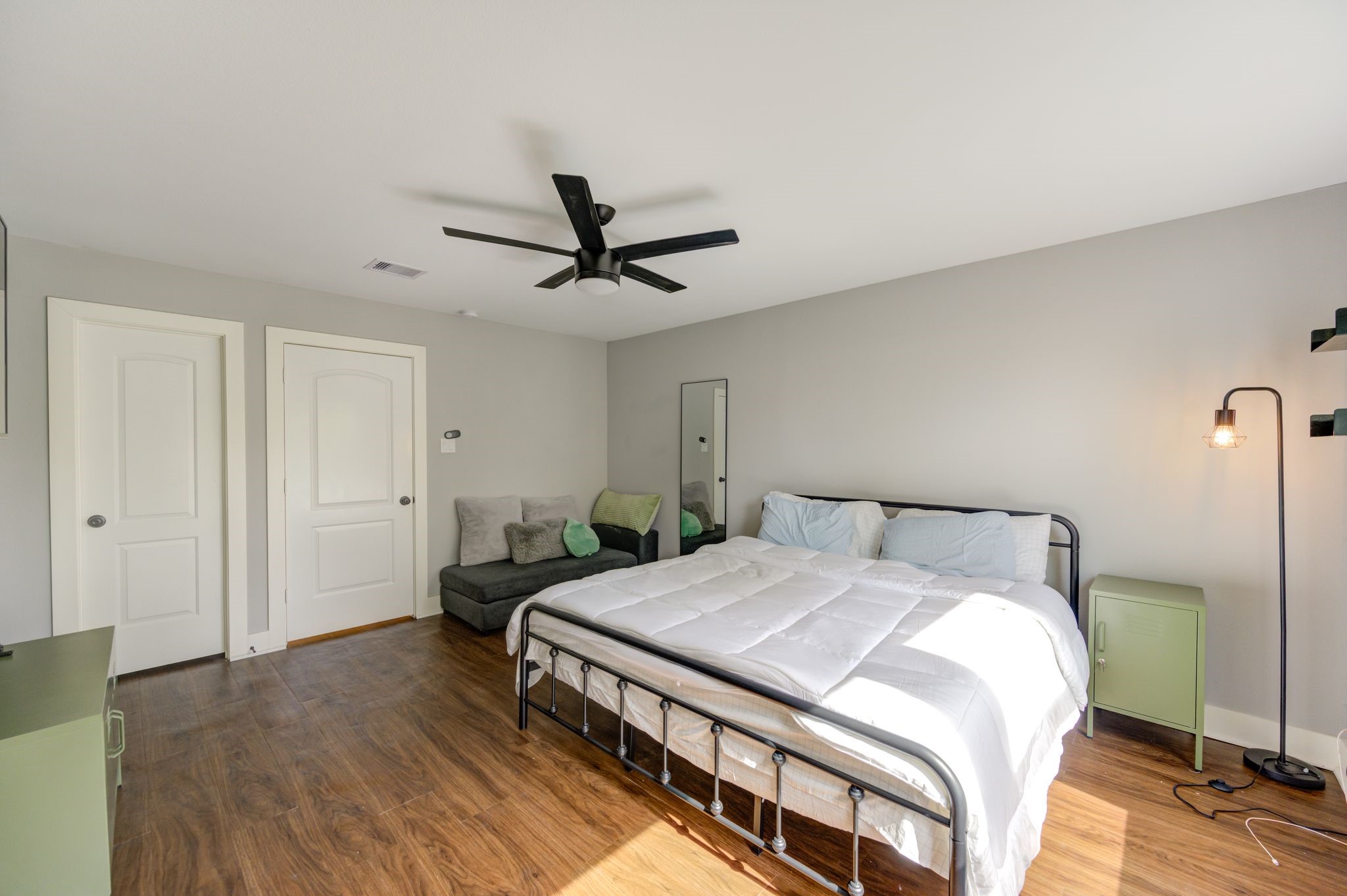 436 Owens Street Houston, TX 77029 - Photo 25 of 33 a bedroom with a bed a chandelier and a dresser
