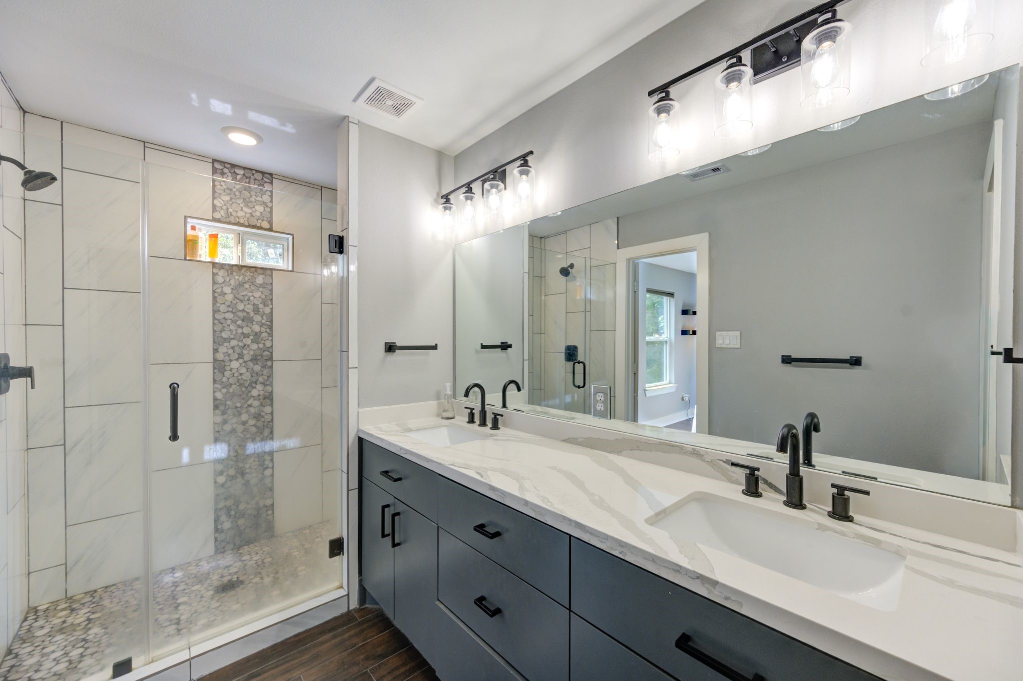436 Owens Street Houston, TX 77029 - Photo 27 of 33 a bathroom with a shower sink and mirror