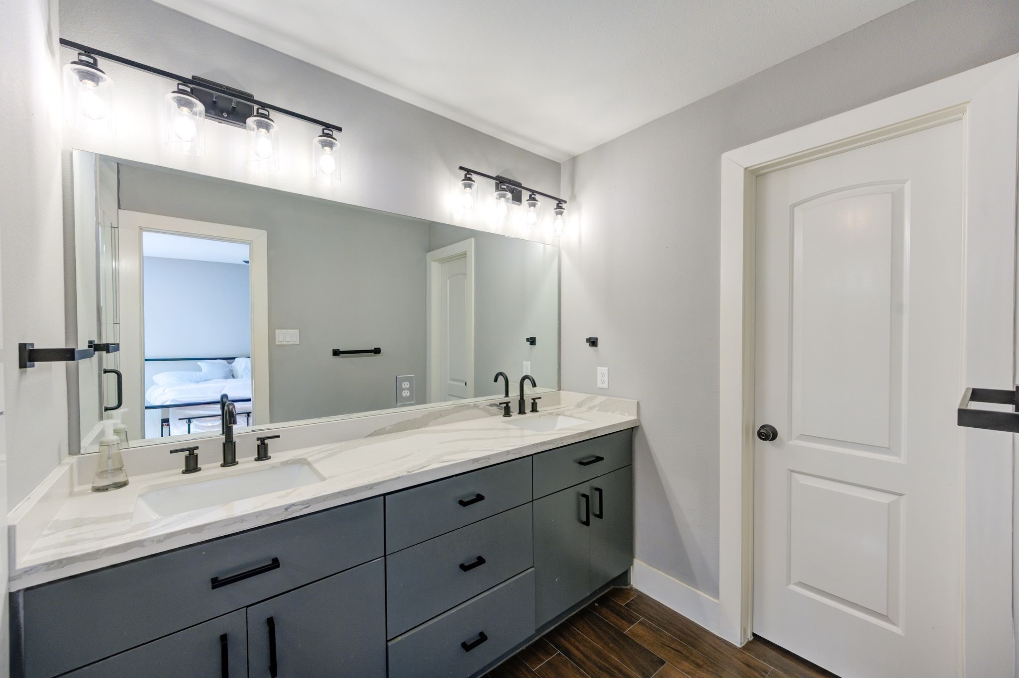 436 Owens Street Houston, TX 77029 - Photo 28 of 33 a bathroom with a double vanity sink and mirror