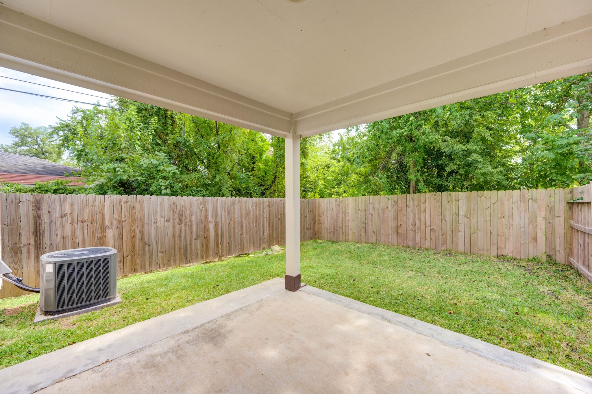 436 Owens Street Houston, TX 77029 - Photo 32 of 33 a view of a backyard with a small cabin and wooden fence