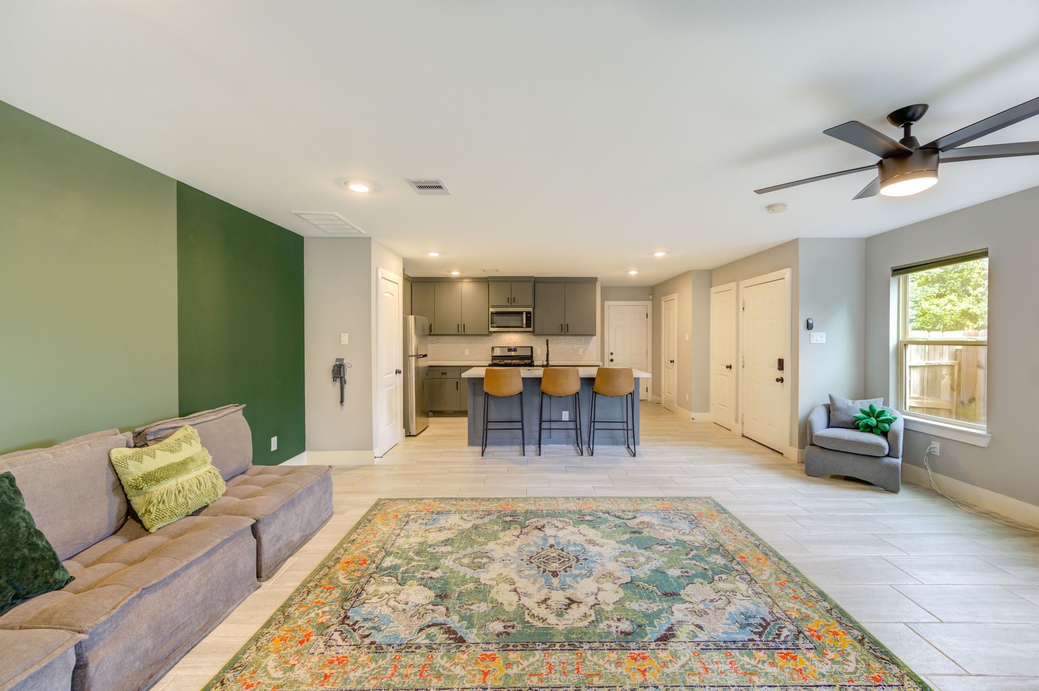 436 Owens Street Houston, TX 77029 - Photo 8 of 33 a living room with furniture and a rug