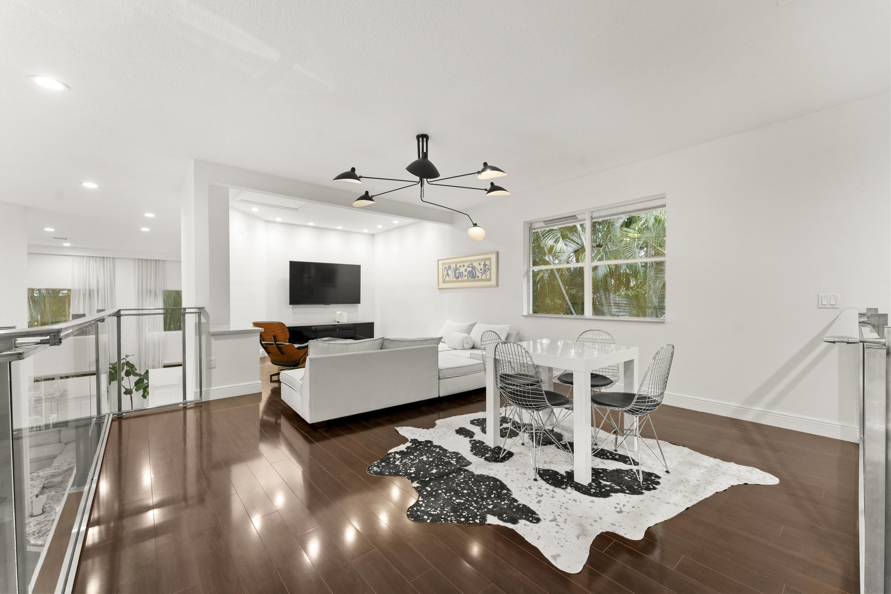 3156 Northwest 61st Street Boca Raton, FL 33496 - Photo 28 of 46 a living room with furniture and a flat screen tv