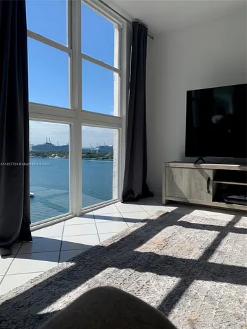 a bed room with a bed and a mirror