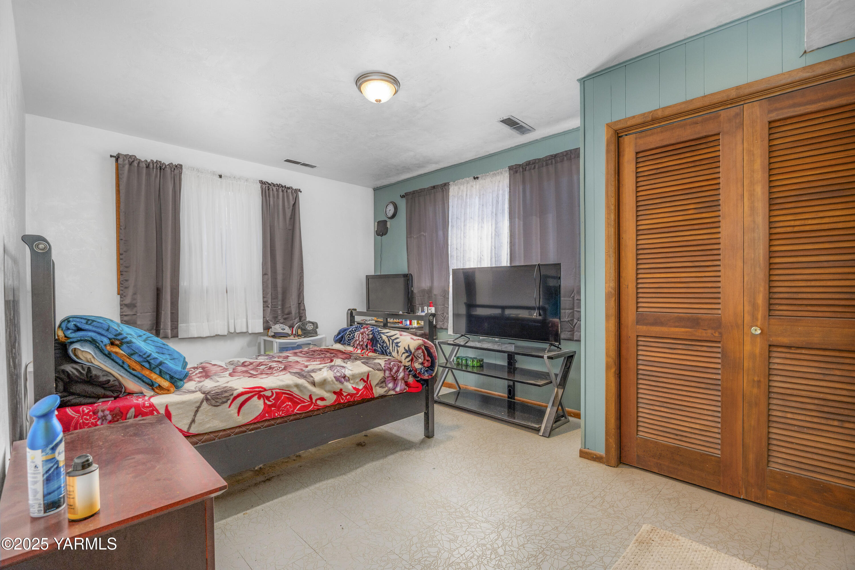 1381 West Riverside Avenue Sunnyside, WA 98944 - Photo 33 of 53 a bedroom with a bed and a flat screen tv