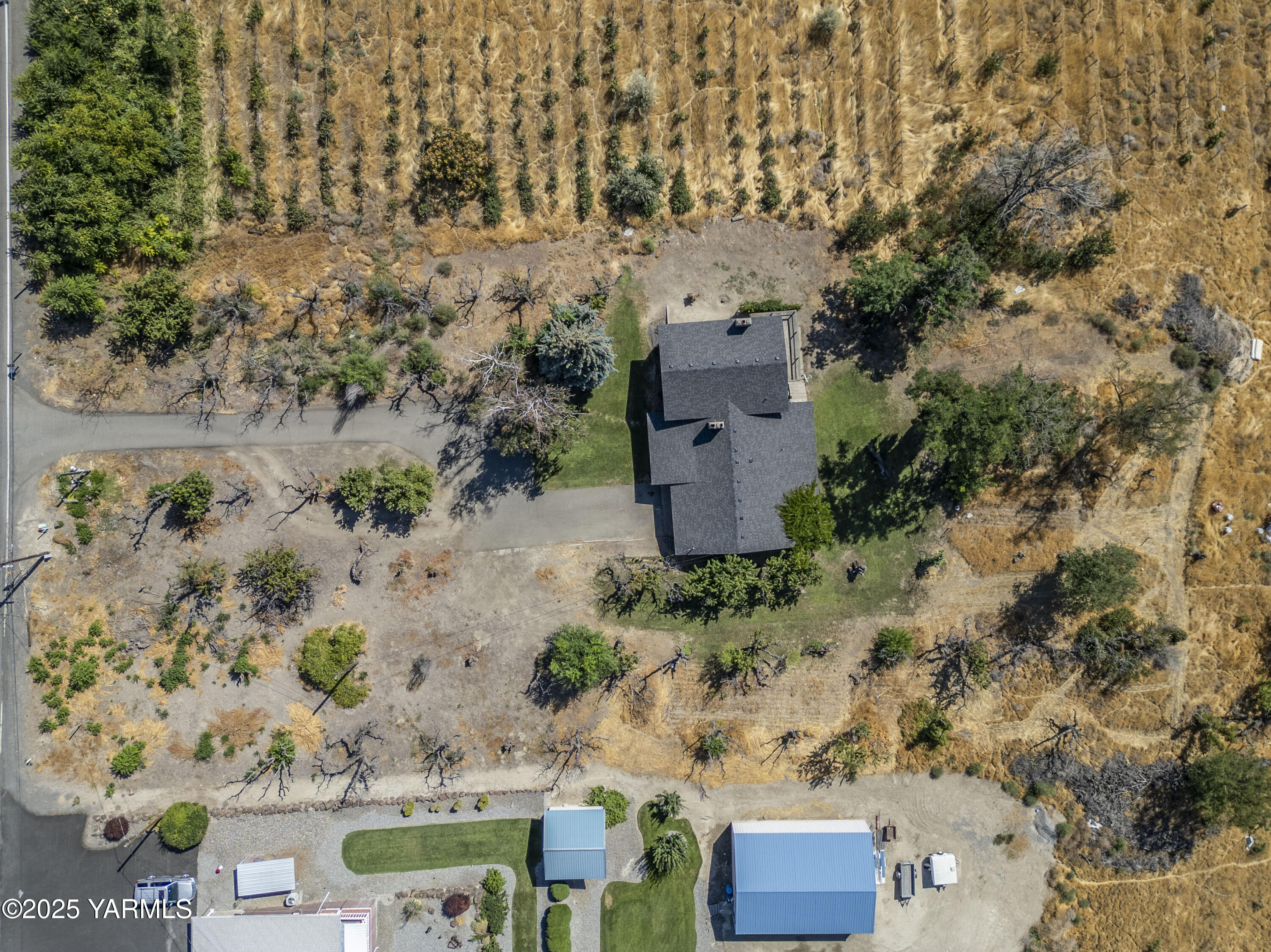 1381 West Riverside Avenue Sunnyside, WA 98944 - Photo 36 of 53 an aerial view of a house with a yard