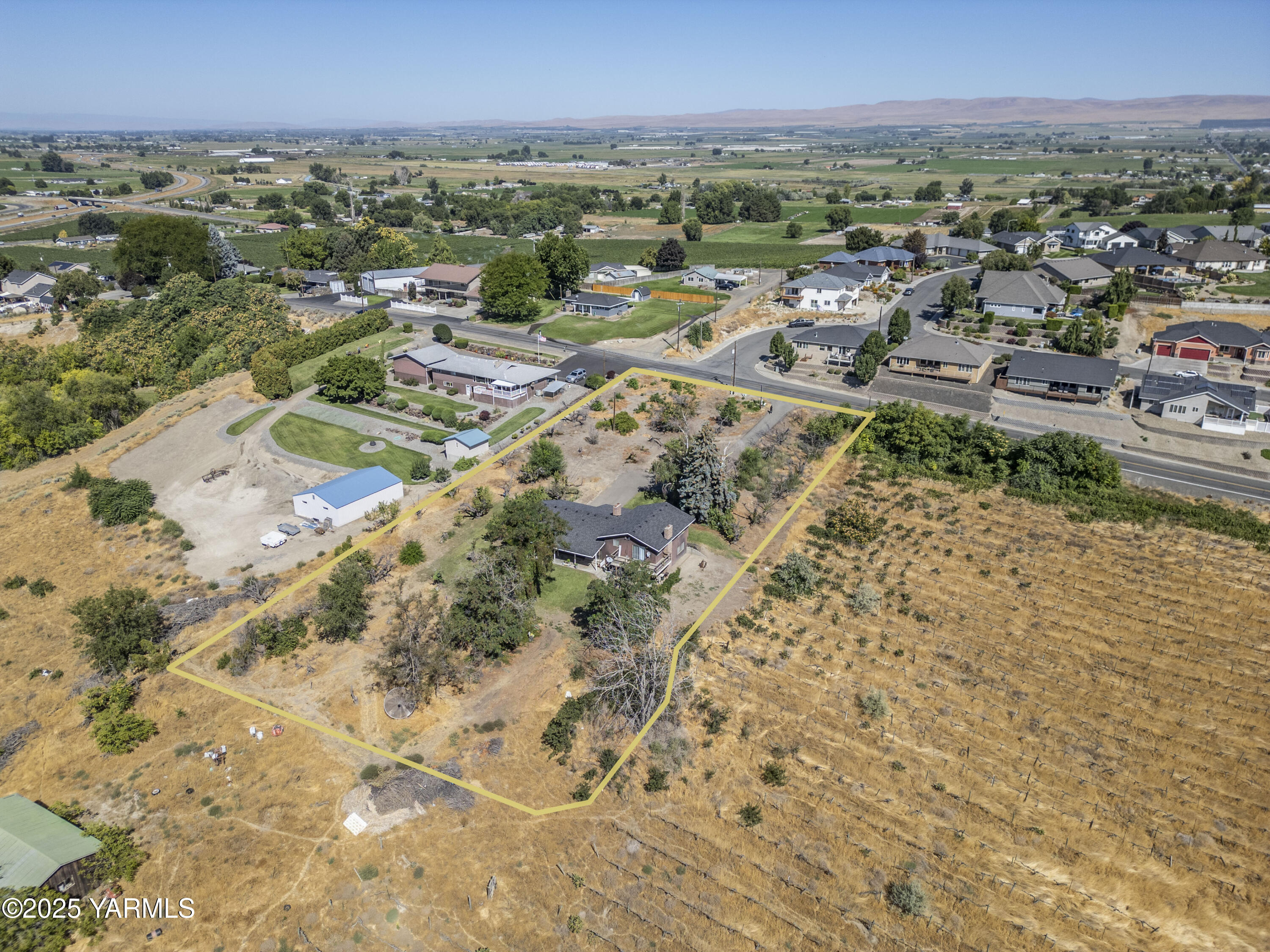 1381 West Riverside Avenue Sunnyside, WA 98944 - Photo 38 of 53 an aerial view of residential houses with outdoor space