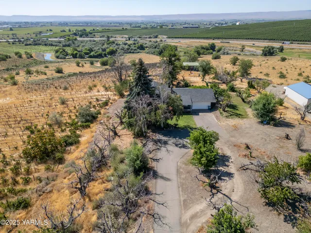 a view of balcony with wooden floor and fence