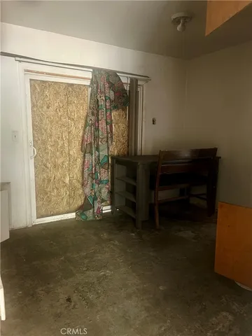 a view of room with furniture and a window