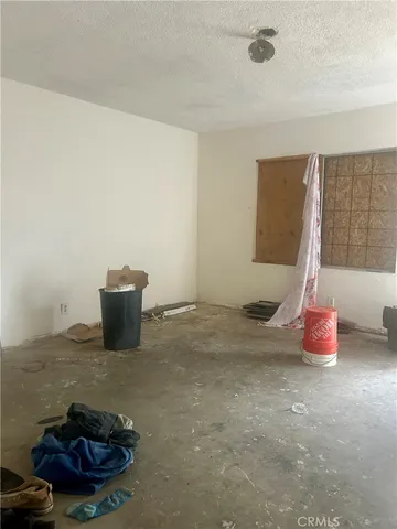 a view of a backyard with table and chairs