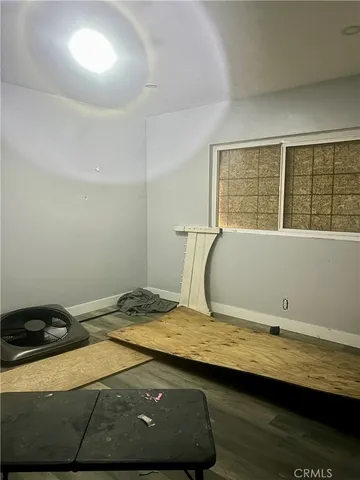 a bedroom with a bed and a dresser next to it