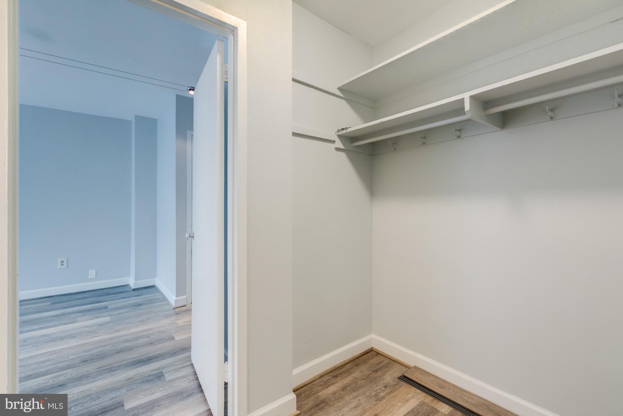 1021 Arlington Boulevard, Unit 647 Arlington, VA 22209 - Photo 17 of 17 a view of walk in closet with empty racks
