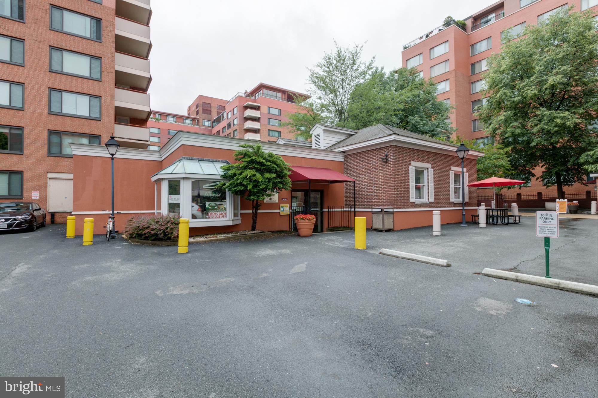 1021 Arlington Boulevard, Unit 647 Arlington, VA 22209 - Photo 5 of 17 a view of a house with a parking space and a street