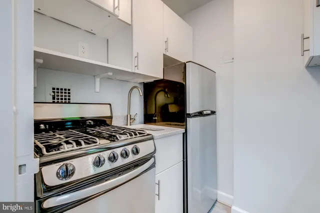 a kitchen with a stove and a microwave